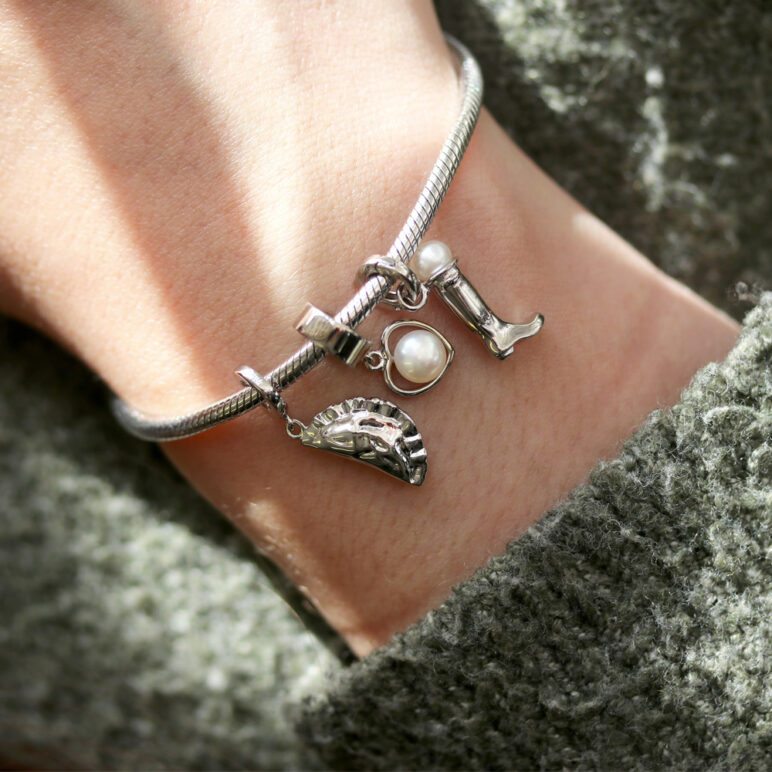 A lifestyle image featuring the new Cornish Pasty charm bracelet.